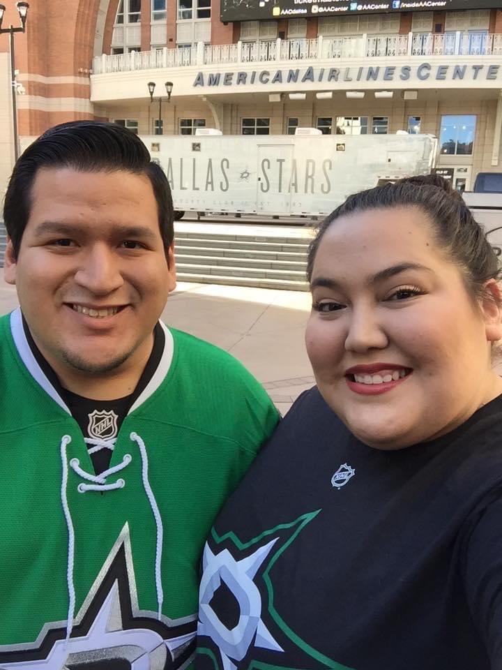 Selena and her fiance at a hockey game